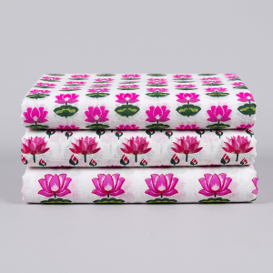 Three folded printed vastra pieces with repeating lotus motifs, styled as a Pushtimarg shringar combo set.