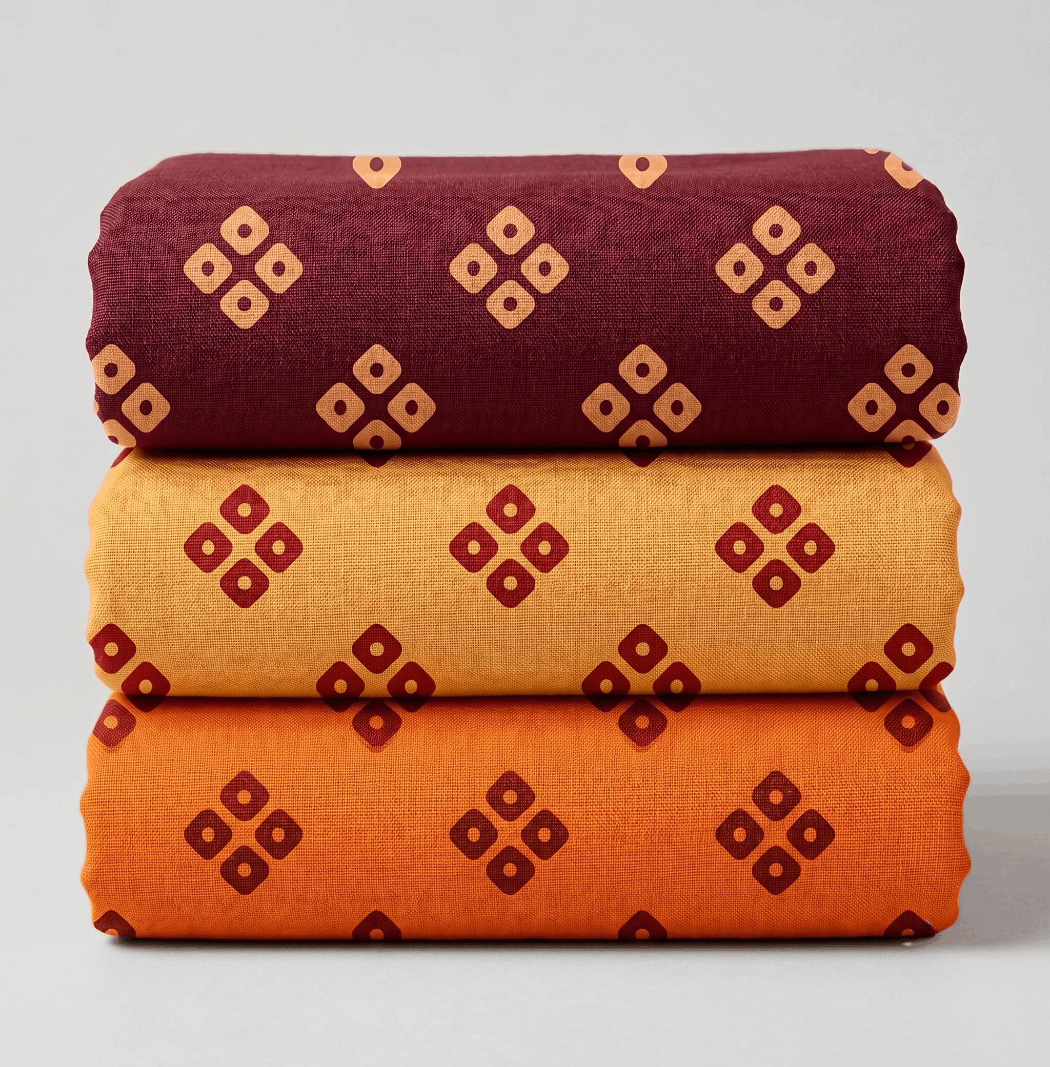 Stacked set of three printed vastra rolls with geometric motifs for Pushtimarg shringar and Thakorji temple dressing.