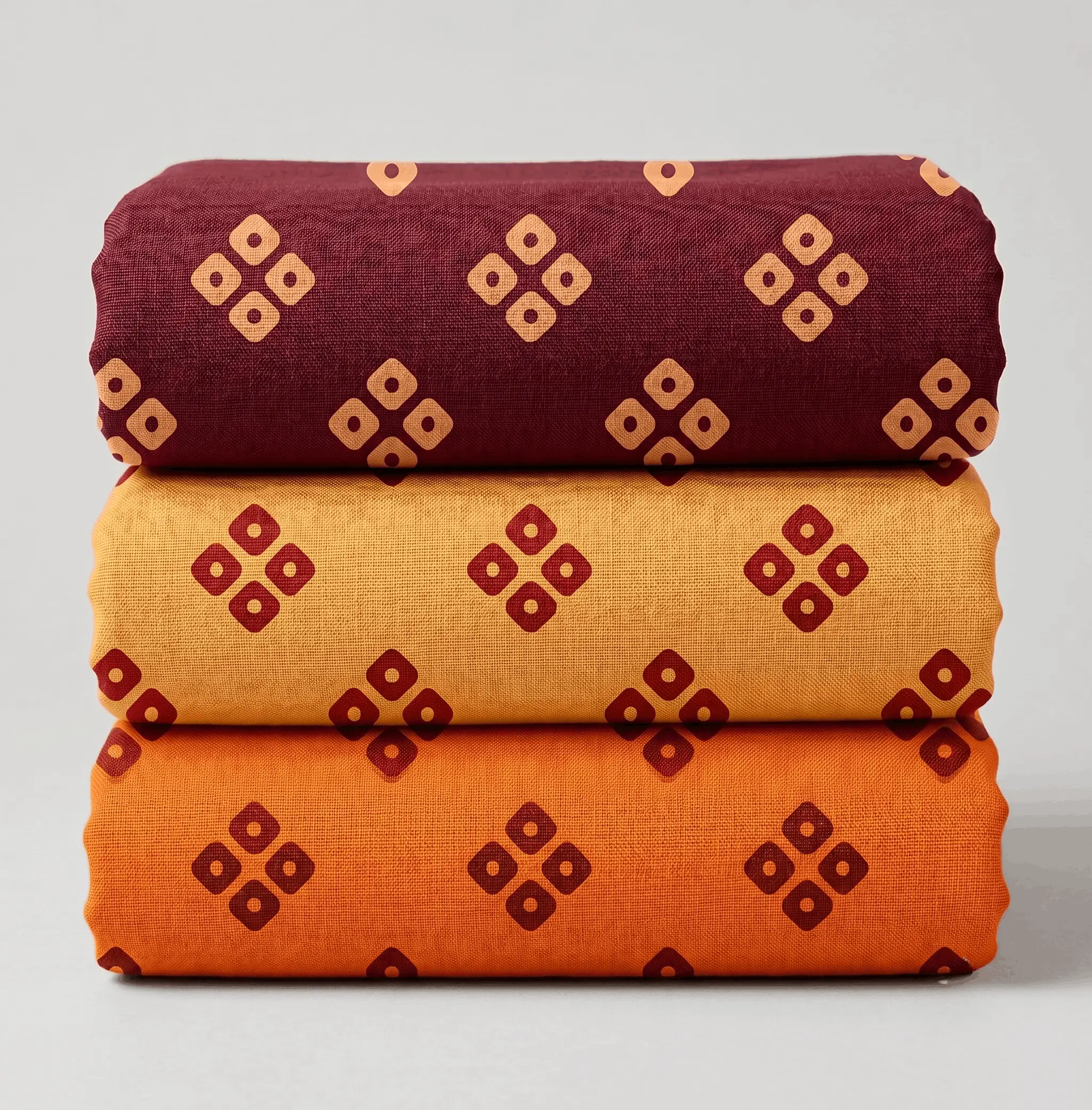 Stacked set of three printed vastra rolls with geometric motifs for Pushtimarg shringar and Thakorji temple dressing.