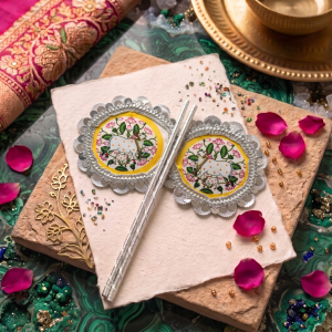 Decorative Thakorji pankha set with cow and calf motif, paired devotional fans styled for puja and mandir seva