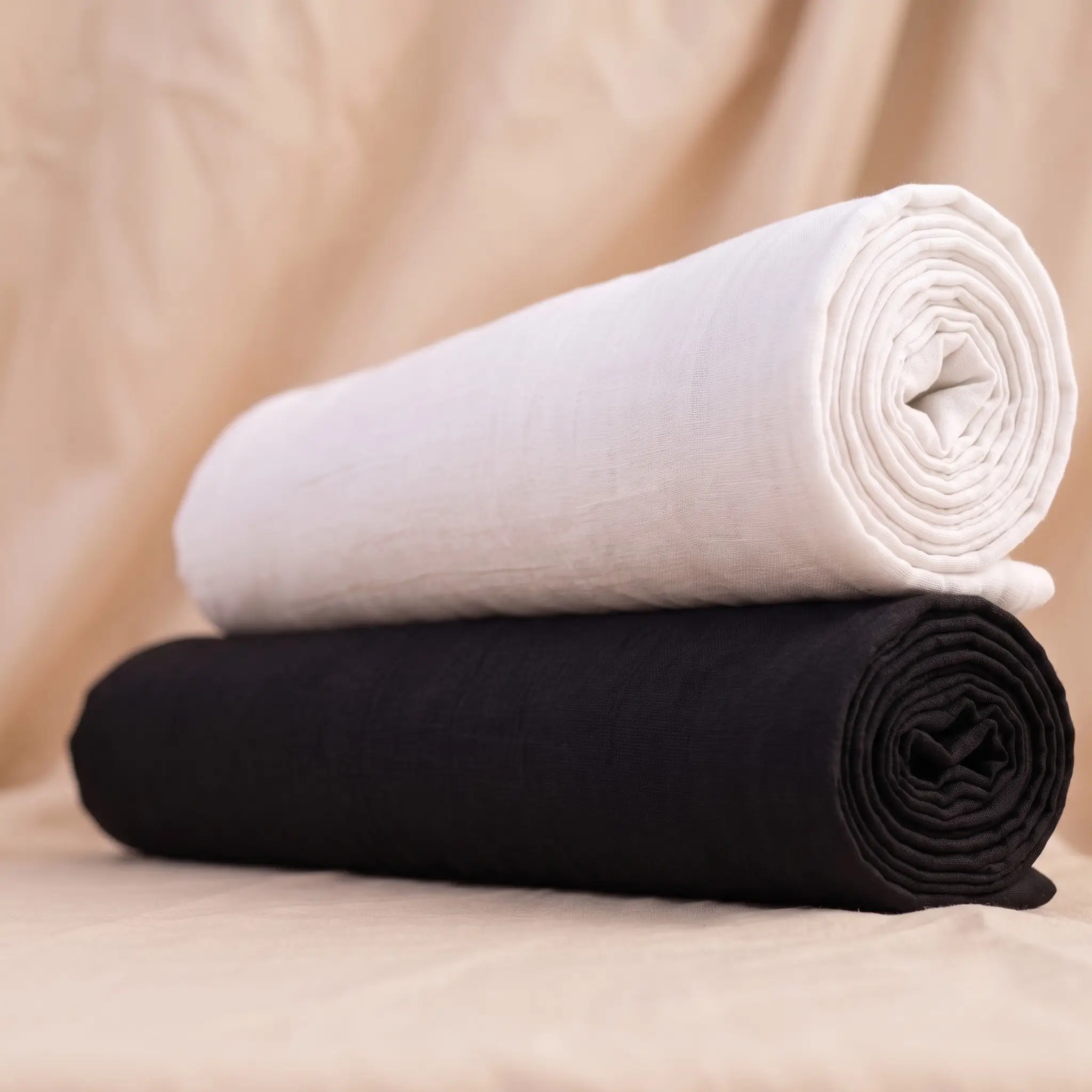 Two rolled plain vastra pieces stacked together as a Thakorji seva pair for shringar and devotional dressing