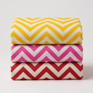 Three folded chevron printed vastra pieces stacked neatly for Thakorji shringar and devotional temple dressing.