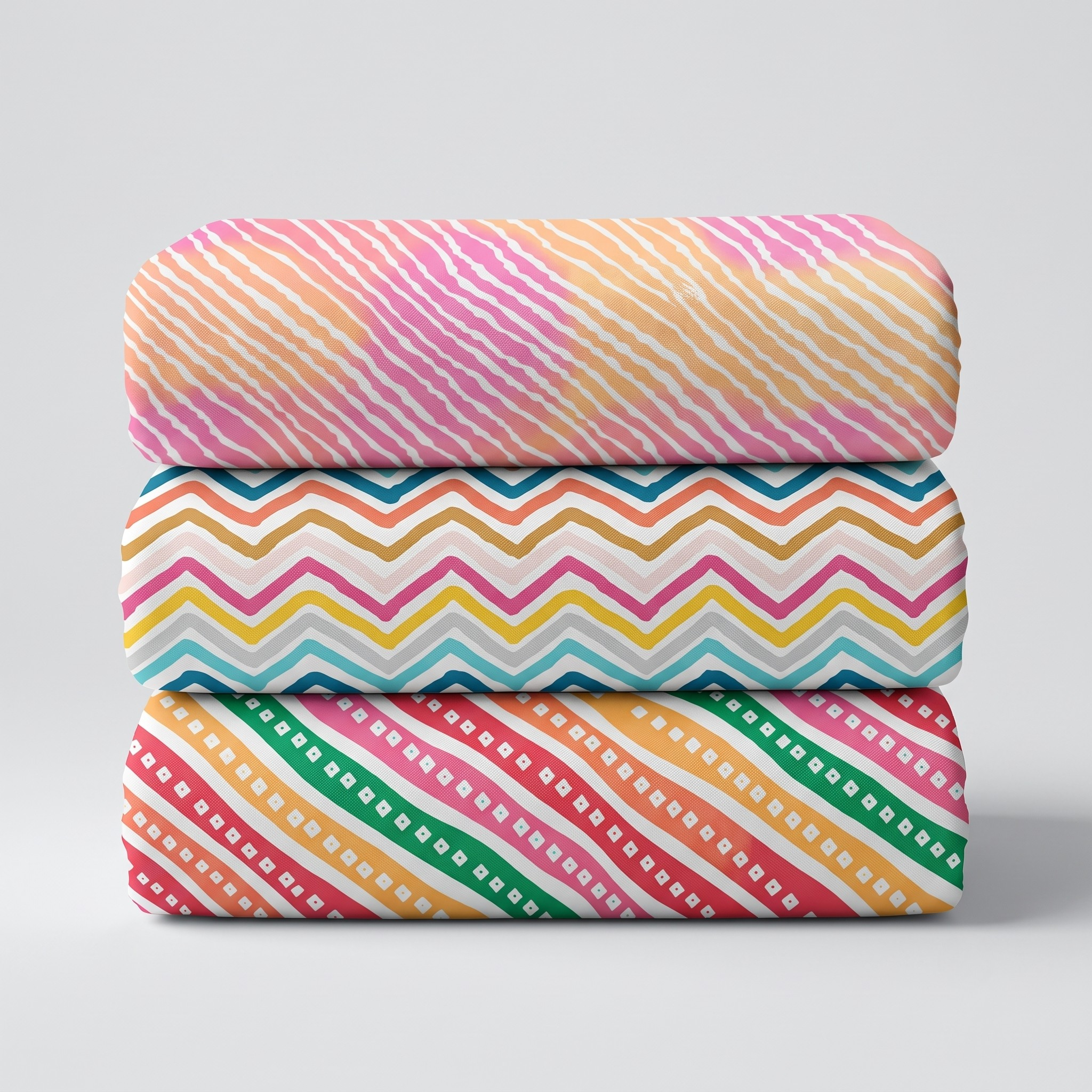 Three rolled printed vastra fabrics in assorted patterns stacked for Thakorji shringar combo display.