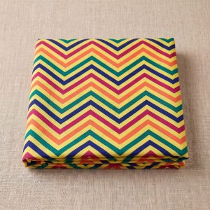 Folded multicolor chevron leheriya fabric with bold zig-zag wave patterns