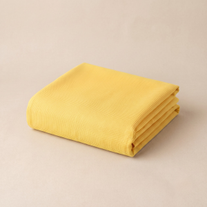 Fine weave yellow doriya malmal kapda for festive Vastra tailoring